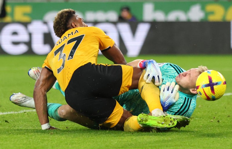 WOLVERHAMPTON, ENGLAND - NOVEMBER 12: Adama Traore of Wolverhampton Wanderers collides with Aaron Ramsdale of Arsenal during the Premier League match between Wolverhampton Wanderers and Arsenal FC at Molineux on November 12, 2022 in Wolverhampton, United Kingdom. (Photo by Marc Atkins/Getty Images)