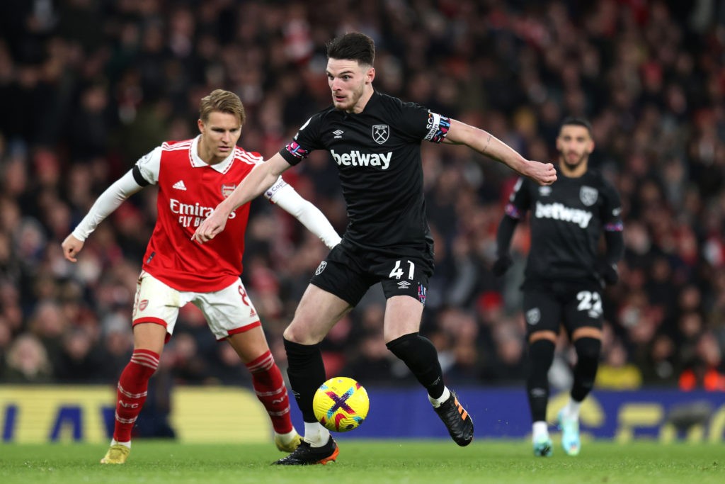 LONDON, ENGLAND - DECEMBER 26: Declan Rice of West Ham United is challenged by Martin Oedegaard of Arsenal during the Premier League match between Arsenal FC and West Ham United at Emirates Stadium on December 26, 2022 in London, England. (Photo by Alex Pantling/Getty Images)