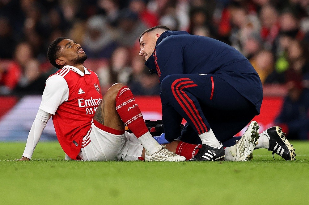 LONDON, ENGLAND: Reiss Nelson of Arsenal receives treatment for a leg injury during the friendly between Arsenal and Juventus at Emirates Stadium on December 17, 2022. (Photo by Ryan Pierse/Getty Images)