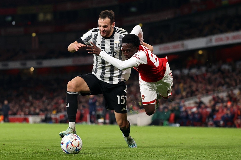 LONDON, ENGLAND: Amario Cozier-Duberry of Arsenal tackles Federico Gatti of Juventus during the friendly between Arsenal and Juventus at Emirates Stadium on December 17, 2022. (Photo by Ryan Pierse/Getty Images)