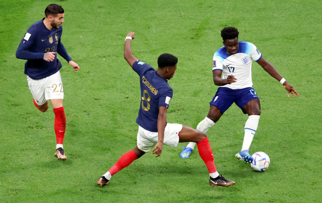 AL KHOR, QATAR: Bukayo Saka of England is fouled by Aurelien Tchouameni of France in the box resulting in a penalty during the FIFA World Cup Qatar 2022 quarter-final match between England and France at Al Bayt Stadium on December 10, 2022. (Photo by Clive Brunskill/Getty Images)