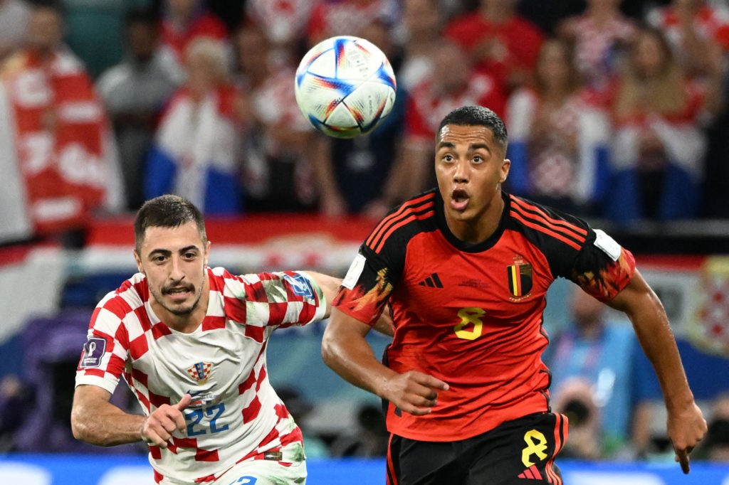 Croatia's defender #22 Josip Juranovic (L) and Belgium's midfielder #08 Youri Tielemans run for the ball during the Qatar 2022 World Cup Group F football match between Croatia and Belgium at the Ahmad Bin Ali Stadium in Al-Rayyan, west of Doha on December 1, 2022. (Photo by CHANDAN KHANNA/AFP via Getty Images)