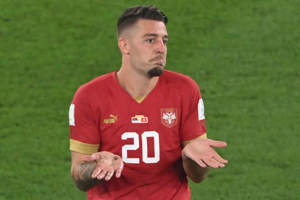 Serbia's midfielder #20 Sergej Milinkovic-Savic reacts after receiving a yellow card during the Qatar 2022 World Cup Group G football match between Serbia and Switzerland at Stadium 974 in Doha on December 2, 2022. (Photo by PATRICK T. FALLON/AFP via Getty Images)