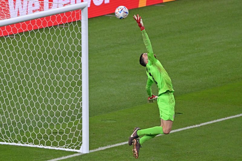 TOPSHOT - USA's goalkeeper #01 Matt Turner jumps to deflect the ball during the Qatar 2022 World Cup round of 16 football match between the Netherlands and USA at Khalifa International Stadium in Doha on December 3, 2022. (Photo by RAUL ARBOLEDA/AFP via Getty Images)