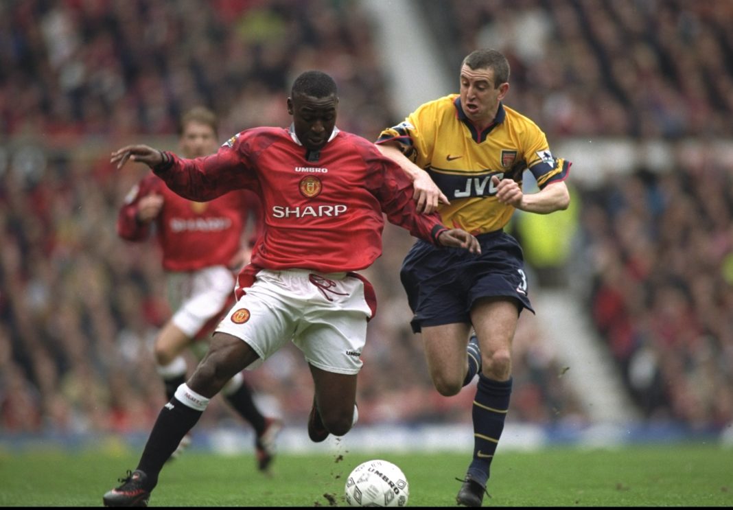 14 Mar 1998: Andy Cole (left) of Manchester United holds off Nigel Winterburn of Arsenal during an FA Carling Premiership match at Old Trafford in Manchester, England. Arsenal won the match 1-0. Credit: Shaun Botterill/Allsport