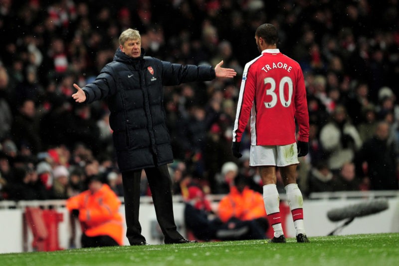 LONDON, ENGLAND - JANUARY 09:  Manager of Arsenal Arsene Wenger speaks to Armand Traore of Arsenal during the Barclays Premier League match between Arsenal and Everton at Emirates Stadium on January 9, 2010 in London, England.  (Photo by Shaun Botterill/Getty Images)