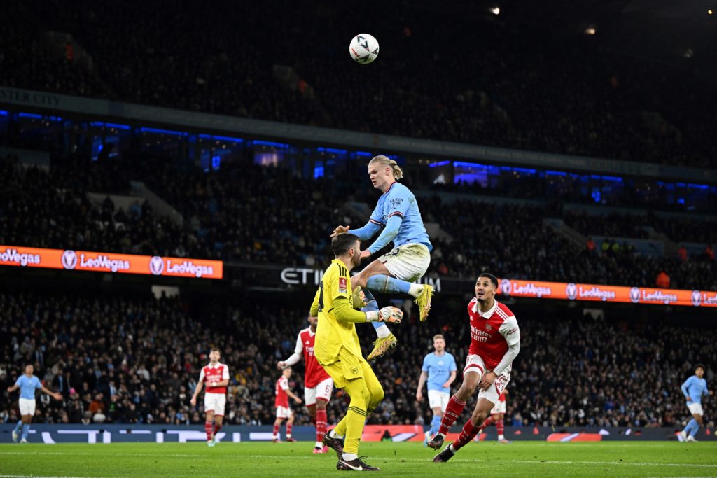 Arsenal's US goalkeeper Matt Turner blocks a shot on goal by Manchester City's Norwegian striker Erling Haaland (C) during the English FA Cup fourth round football match between Manchester City and Arsenal at the Etihad Stadium in Manchester, northwest England, on January 27, 2023. (Photo by OLI SCARFF/AFP via Getty Images)