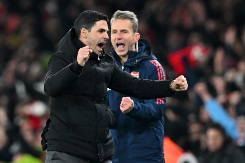 Arsenal's Spanish manager Mikel Arteta (L) celebrates their win on the final whistle of the English Premier League football match between Arsenal and Manchester United at the Emirates Stadium in London on January 22, 2023. - Arsenal won the game 3-2. (Photo by GLYN KIRK/AFP via Getty Images)