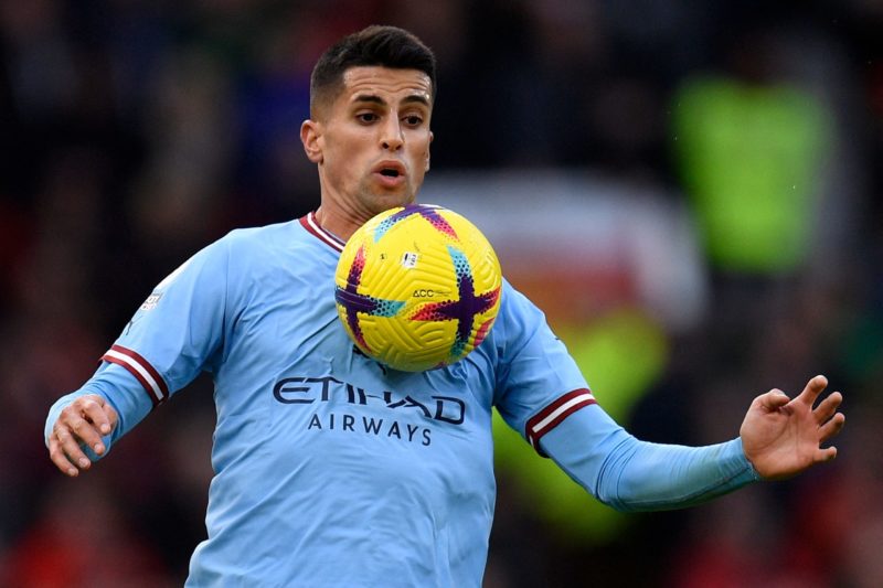 Arsenal Cancelo chase - Manchester City's Portuguese defender Joao Cancelo controls the ball during the English Premier League football match between Manchester United and Manchester City at Old Trafford in Manchester, north west England, on January 14, 2023. (Photo by OLI SCARFF/AFP via Getty Images)
