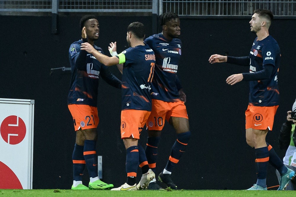 Montpellier's French forward Elye Wahi (left) celebrates with his teammates after scoring a goal in the French L1 football match between FC Lorient and Montpellier Herault SC on 29 December 2022 at the Yves Allainmat - Le Moustoir stadium in Lorient.  (Photo: LOIC VENANCE/AFP via Getty Images)