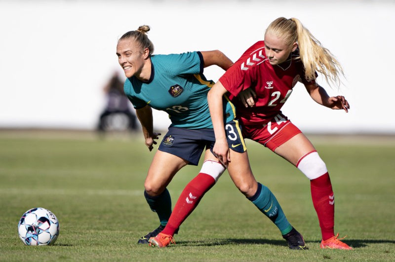Denmark's Kathrine Kuhl and Australia's Tameka Yallop vie for the ball during the women's international friendly football match between Denmark and Australia in Horsens, Denmark on June 10, 2021. - - Denmark OUT (Photo by Henning Bagger / Ritzau Scanpix / AFP) / Denmark OUT (Photo by HENNING BAGGER/Ritzau Scanpix/AFP via Getty Images)