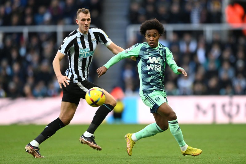 NEWCASTLE UPON TYNE, ENGLAND - JANUARY 15: Willian of Fulham battles for possession with Dan Burn of Newcastle United during the Premier League match between Newcastle United and Fulham FC at St. James Park on January 15, 2023 in Newcastle upon Tyne, England. (Photo by Michael Regan/Getty Images)