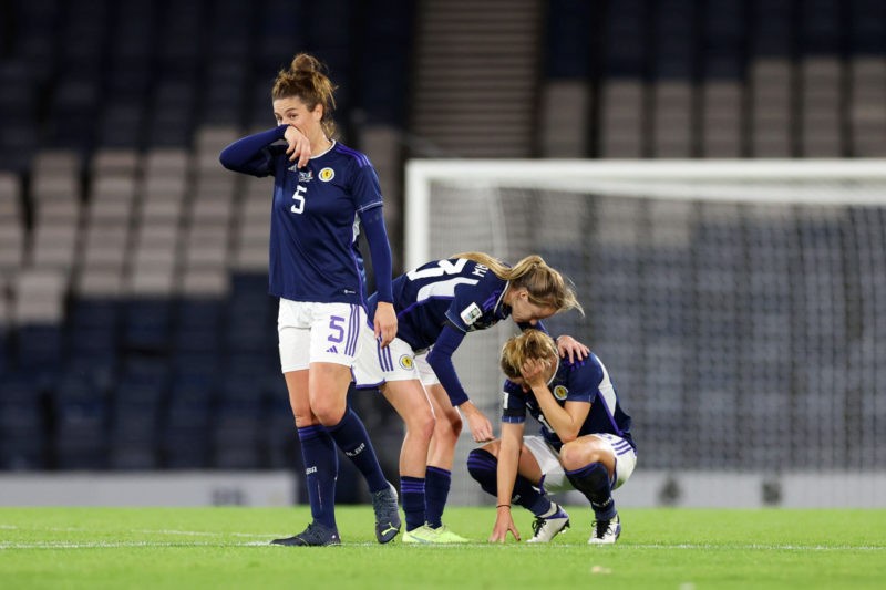 GLASGOW, SCOTLAND - OCTOBER 11: Jen Beattie, Christy Louise Grimshaw and Sophie Howard of Scotland look dejected after missing out on qualification for the 2023 FIFA Women's World Cup after defeat during the 2023 FIFA Women's World Cup play-off round 2 match between Scotland and Republic of Ireland at Hampden Park on October 11, 2022 in Glasgow, Scotland. (Photo by Ian MacNicol/Getty Images)