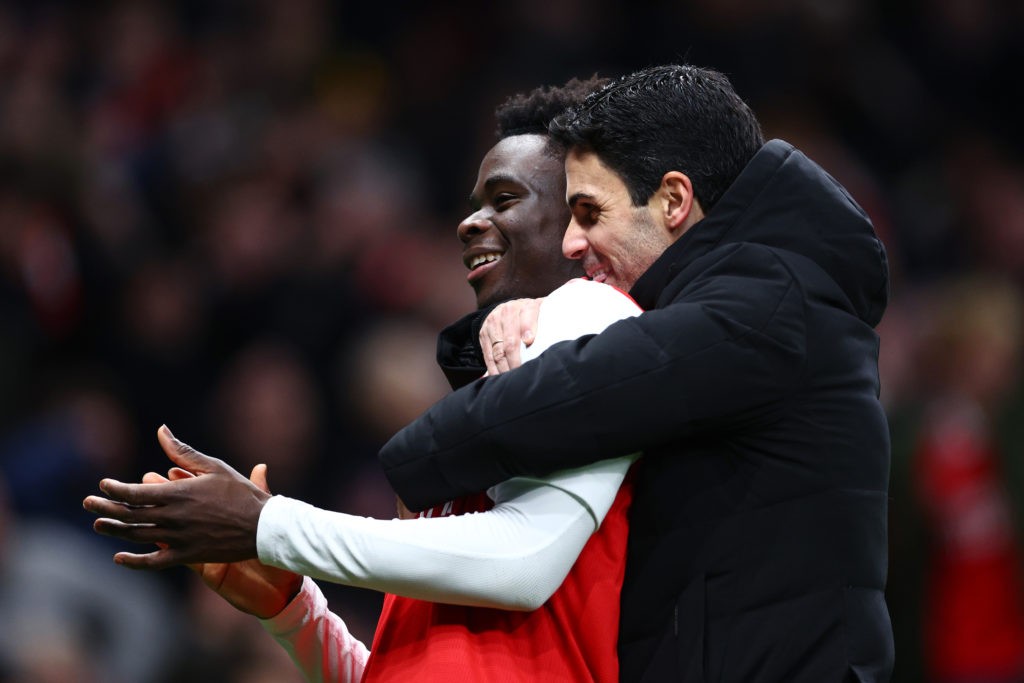 LONDON, ENGLAND - JANUARY 15: Bukayo Saka and Mikel Arteta, Manager of Arsenal, celebrate after the team's victory during the Premier League match between Tottenham Hotspur and Arsenal FC at Tottenham Hotspur Stadium on January 15, 2023 in London, England. (Photo by Clive Rose/Getty Images)