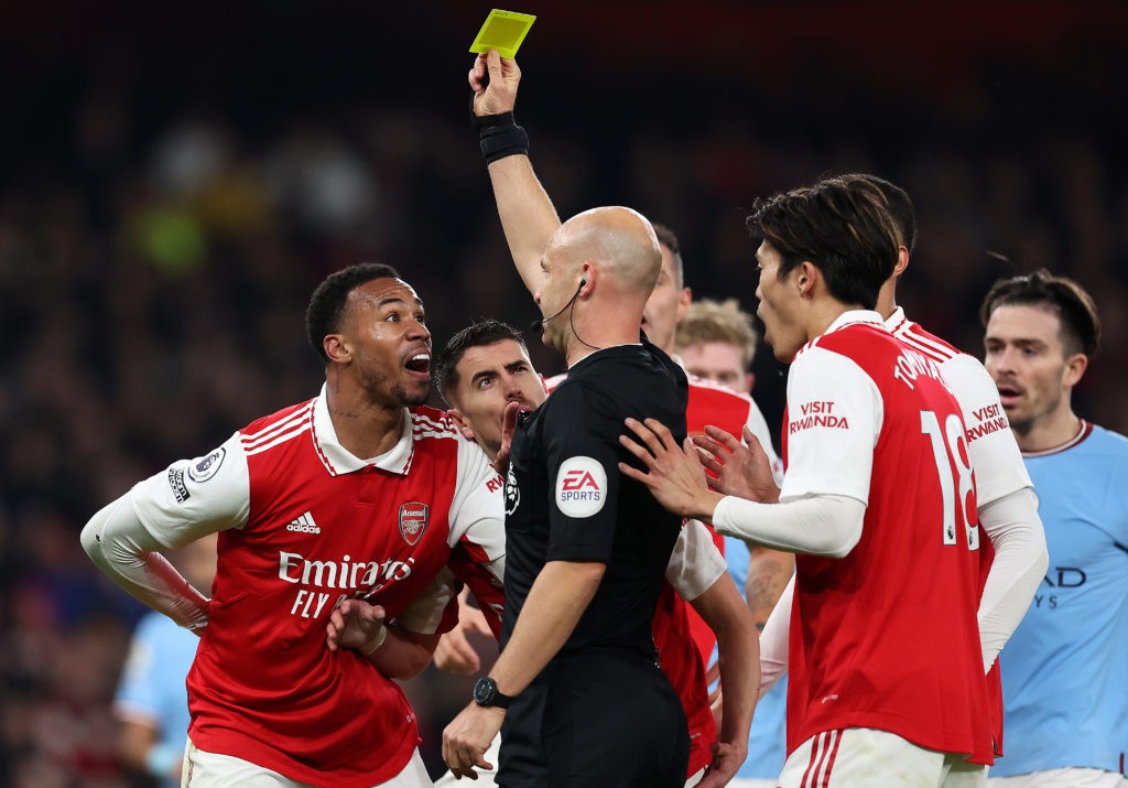 LONDON, ENGLAND: Referee Anthony Taylor awards a yellow card to Gabriel of Arsenal, before the decision is reversed following a VAR Penalty Review, during the Premier League match between Arsenal FC and Manchester City at Emirates Stadium on February 15, 2023. (Photo by Julian Finney/Getty Images)
