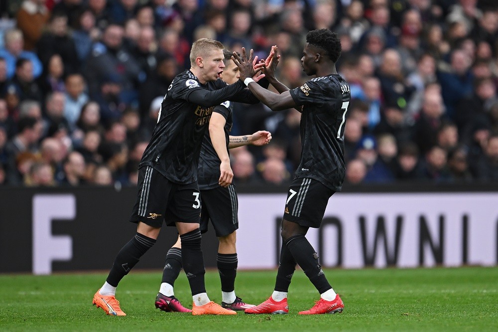 BIRMINGHAM, ENGLAND: Oleksandr Zinchenko celebrates with Bukayo Saka of Arsenal after scoring the team's second goal during the Premier League match between Aston Villa and Arsenal FC at Villa Park on February 18, 2023. (Photo by Clive Mason/Getty Images)