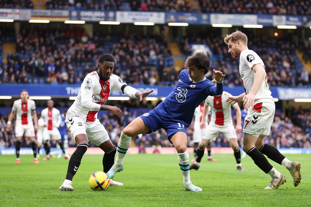 LONDON, ENGLAND: Joao Felix of Chelsea is challenged by Ainsley Maitland-Niles and Stuart Armstrong of Southampton during the Premier League match between Chelsea FC and Southampton FC at Stamford Bridge on February 18, 2023. (Photo by Julian Finney/Getty Images)