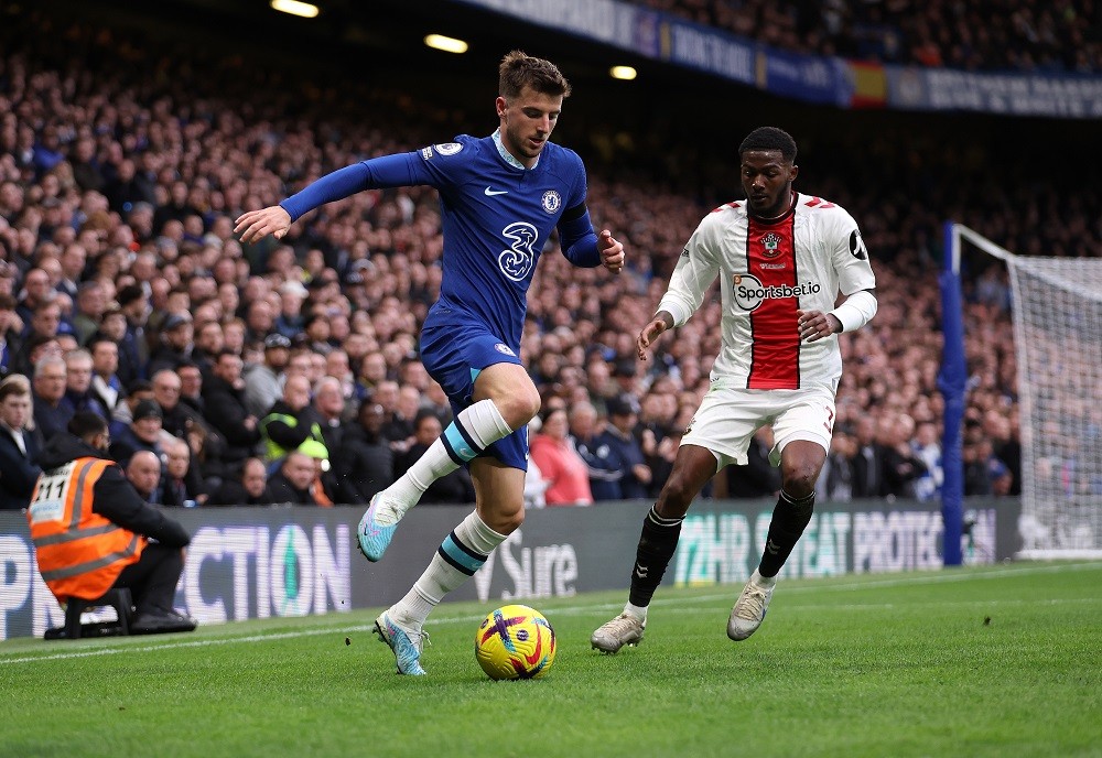 LONDON, ENGLAND: Mason Mount of Chelsea in action with Ainsley Maitland-Niles of Southampton during the Premier League match between Chelsea FC and Southampton FC at Stamford Bridge on February 18, 2023. (Photo by Julian Finney/Getty Images)