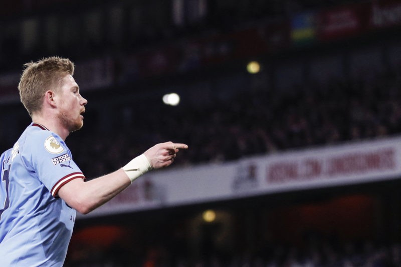 Manchester City's Belgian midfielder Kevin De Bruyne (R) celebrates his team first goal during the English Premier League football match between Arsenal and Manchester City at the Emirates Stadium in London on February 15, 2023.(Photo by IAN KINGTON/IKIMAGES/AFP via Getty Images)