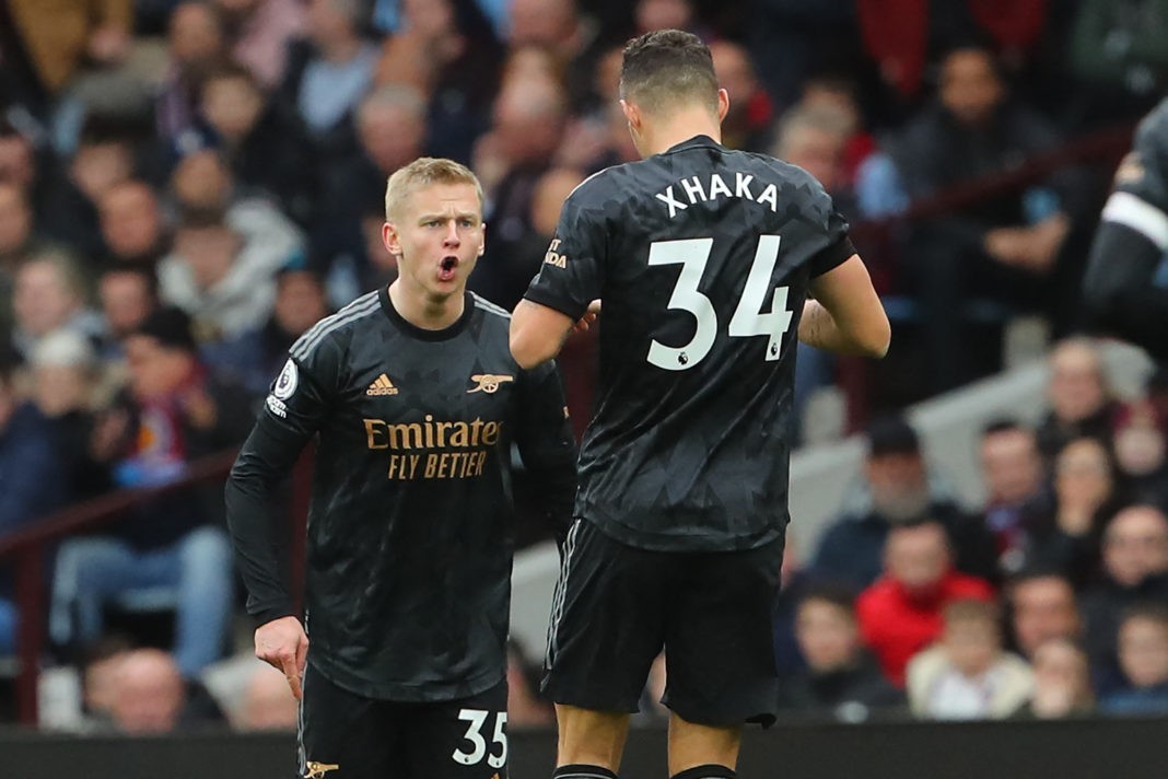 Arsenal's Ukrainian defender Oleksandr Zinchenko (L) celebrates with Arsenal's Swiss midfielder Granit Xhaka (R) after scoring their second goal during the English Premier League football match between Aston Villa and Arsenal at Villa Park in Birmingham, central England on February 18, 2023. (Photo by GEOFF CADDICK/AFP via Getty Images)