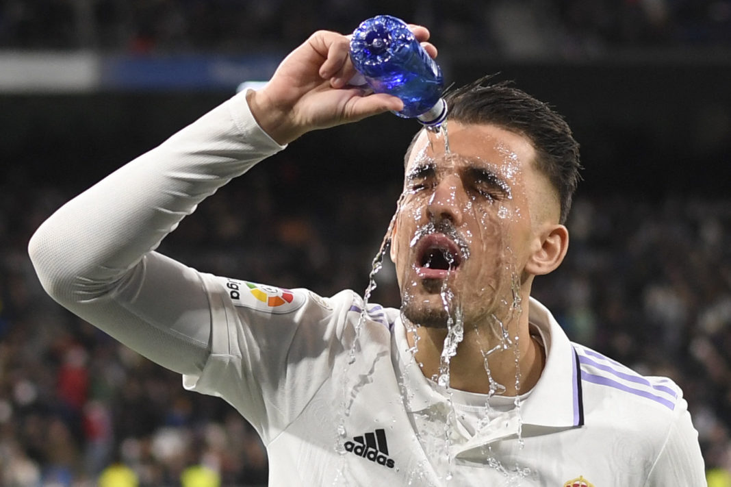 Real Madrid's Spanish midfielder Dani Ceballos pours water on his face during the Spanish league football match between Real Madrid CF and Real Sociedad at the Santiago Bernabeu stadium in Madrid on January 29, 2023. (Photo by OSCAR DEL POZO/AFP via Getty Images)