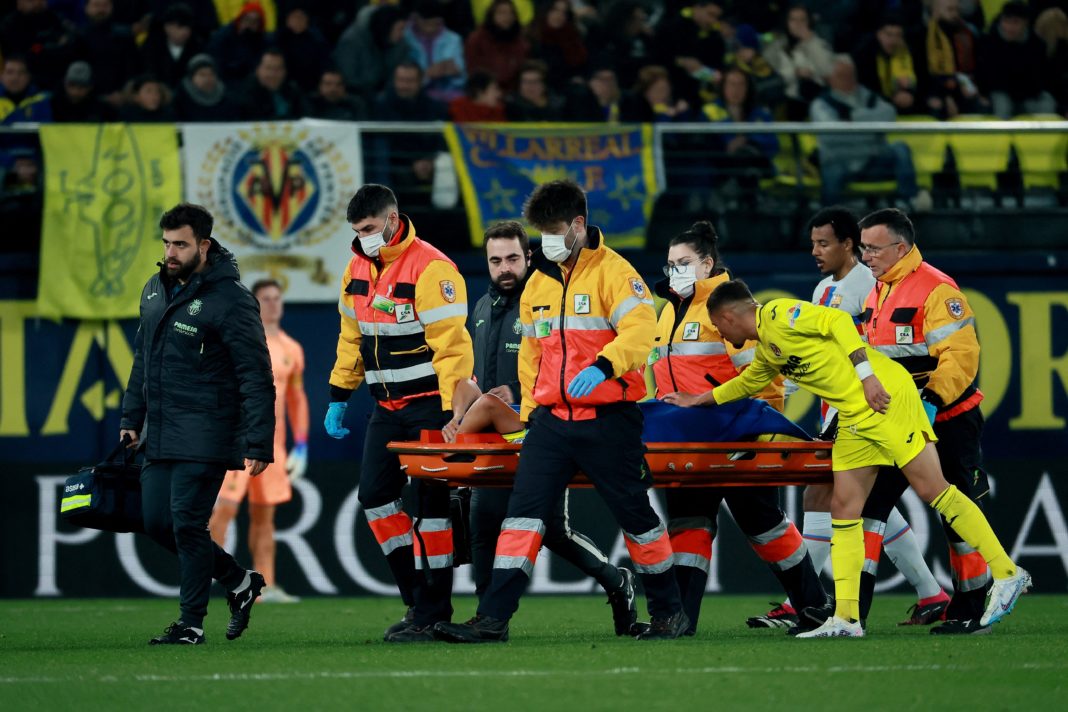 Villarreal's French midfielder Francis Coquelin injured leaves the pitch on a stretcher during the Spanish League football match between Villarreal CF and FC Barcelona at La Ceramica stadium in Vila-real on February 12, 2023. (Photo by JOSE JORDAN / AFP) (Photo by JOSE JORDAN/AFP via Getty Images)
