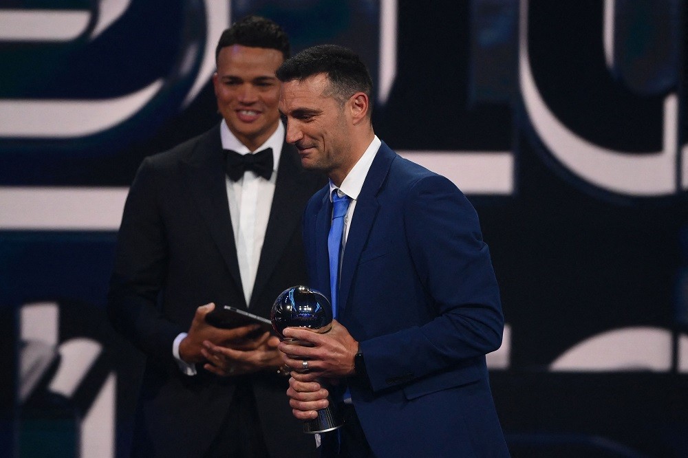 Argentina's coach Lionel Scaloni (R) reacts after receiving the Best FIFA Mens Coach award during the Best FIFA Football Awards 2022 ceremony in Paris on February 27, 2023. (Photo by FRANCK FIFE/AFP via Getty Images)