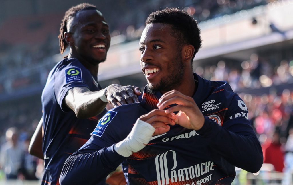 Montpellier's French forward Elye Wahi (R) celebrates with teammates after scoring during the French L1 football match between Montpellier Herault SC and Stade Brestois 29 (Brest) at The Stade de la Mosson in Montpellier, southern France on February 12, 2023. (Photo by PASCAL GUYOT/AFP via Getty Images)
