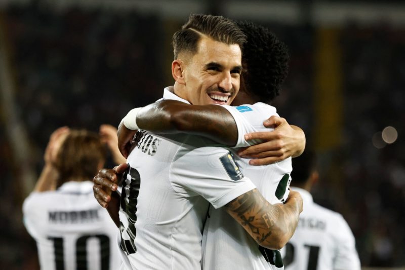 Real Madrid's Brazilian forward Vinicius Junior (R) celebrates with Real Madrid's Spanish midfielder Dani Ceballos after scoring his team's fifth goal during the FIFA Club World Cup final football match between Spain's Real Madrid and Saudi Arabia's Al-Hilal at the Prince Moulay Abdellah Stadium in Rabat on February 11, 2023. (Photo by Khaled DESOUKI / AFP) (Photo by KHALED DESOUKI/AFP via Getty Images)