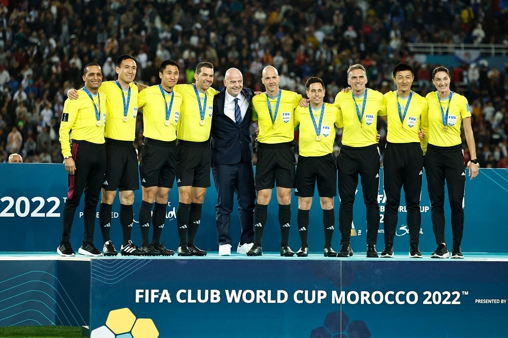 FIFA President Gianni Infantino (C) poses for a picture with the referees at the end of the FIFA Club World Cup final football match between Spain's Real Madrid and Saudi Arabia's Al-Hilal at the Prince Moulay Abdellah Stadium in Rabat on February 11, 2023. (Photo by KHALED DESOUKI/AFP via Getty Images)