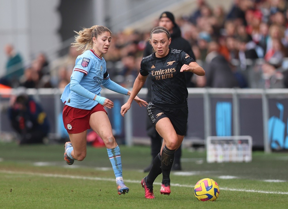 MANCHESTER, ENGLAND: Katie McCabe of Arsenal battles for possession with Laia Aleixandri of Manchester City during the FA Women's Super League match between Manchester City and Arsenal at The Academy Stadium on February 11, 2023. (Photo by Nathan Stirk/Getty Images)