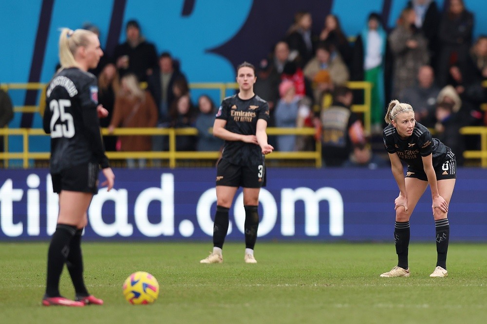 MANCHESTER, ENGLAND: Leah Williamson of Arsenal looks dejected after Chloe Kelly (not pictured) of Manchester City scores the team's second goal during the FA Women's Super League match between Manchester City and Arsenal at The Academy Stadium on February 11, 2023. (Photo by Nathan Stirk/Getty Images)