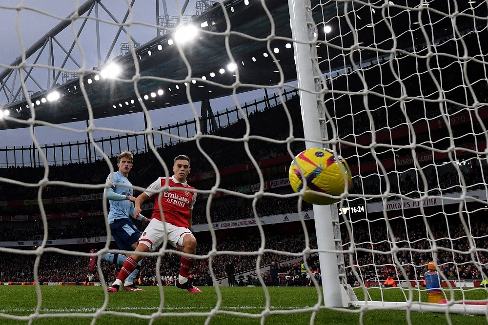 Arsenal's Belgian midfielder Leandro Trossard (C) celebrates scoring the team's first goal during the English Premier League football match between Arsenal and Brentford at the Emirates Stadium in London on February 11, 2023. (Photo by JUSTIN TALLIS/AFP via Getty Images)
