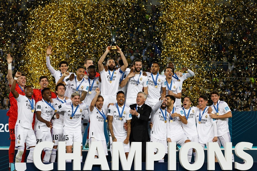 Real Madrid's players celebrate with the trophy at the end of the FIFA Club World Cup final football match between Spain's Real Madrid and Saudi Arabia's Al-Hilal at the Prince Moulay Abdellah Stadium in Rabat on February 11, 2023. (Photo by KHALED DESOUKI/AFP via Getty Images)