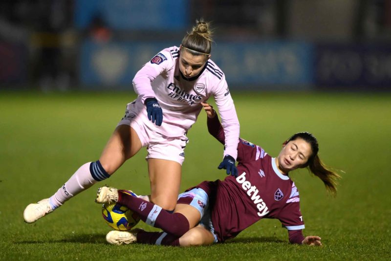 DAGENHAM, ENGLAND - FEBRUARY 05: Steph Catley of Arsenal battles for possession with Risa Shimizu of West Ham United during the FA Women's Super League match between West Ham United and Arsenal at Chigwell Construction Stadium on February 05, 2023 in Dagenham, England. (Photo by Justin Setterfield/Getty Images)