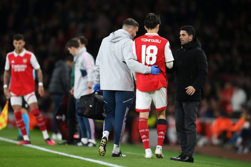LONDON, ENGLAND - MARCH 16: Mikel Arteta, Manager of Arsenal, speaks to Takehiro Tomiyasu of Arsenal as he leaves the pitch after picking up an injury during the UEFA Europa League round of 16 leg two match between Arsenal FC and Sporting CP at Emirates Stadium on March 16, 2023 in London, England. (Photo by Mike Hewitt/Getty Images)