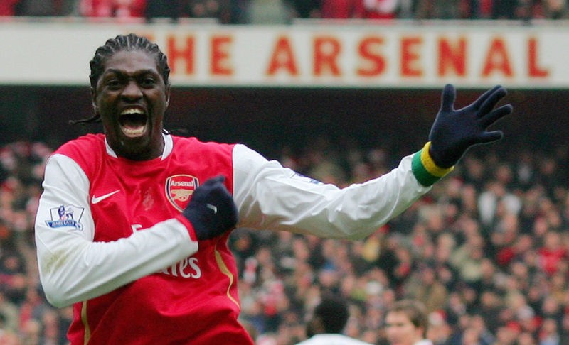 Emmanuel Adebayor celebrates after scoring a goal for Arsenal against Tottenham during a Premiership match at the Emirates football stadium on December 22, 2007. Arsenal won the match 2-1. The photo is credited to CARL DE SOUZA/AFP via Getty Images.
