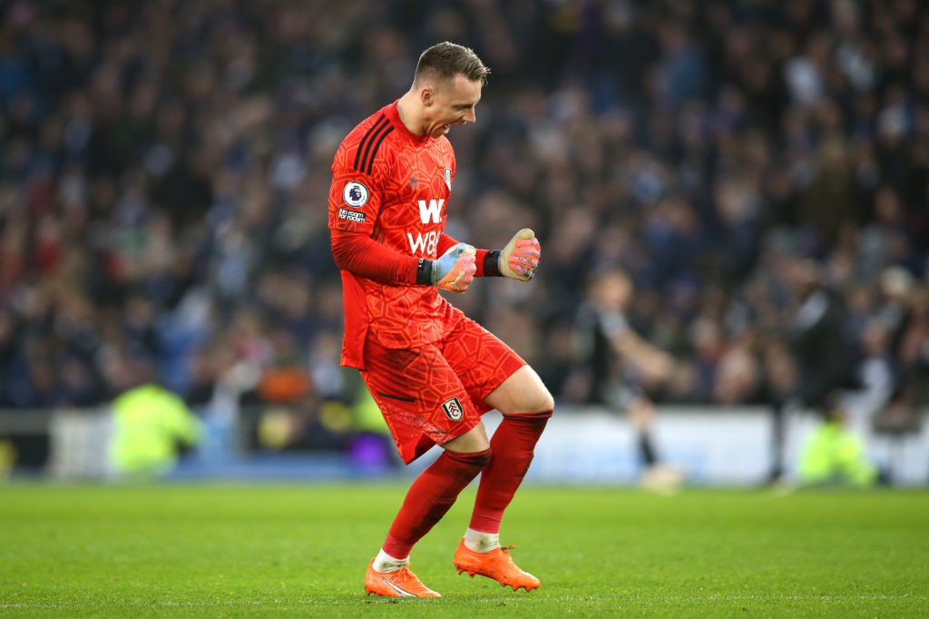 BRIGHTON, ENGLAND - FEBRUARY 18: Bernd Leno of Fulham celebrates after teammate Manor Solomon (not pictured) scores the team's first goal during the Premier League match between Brighton & Hove Albion and Fulham FC at American Express Community Stadium on February 18, 2023 in Brighton, England. (Photo by Steve Bardens/Getty Images)