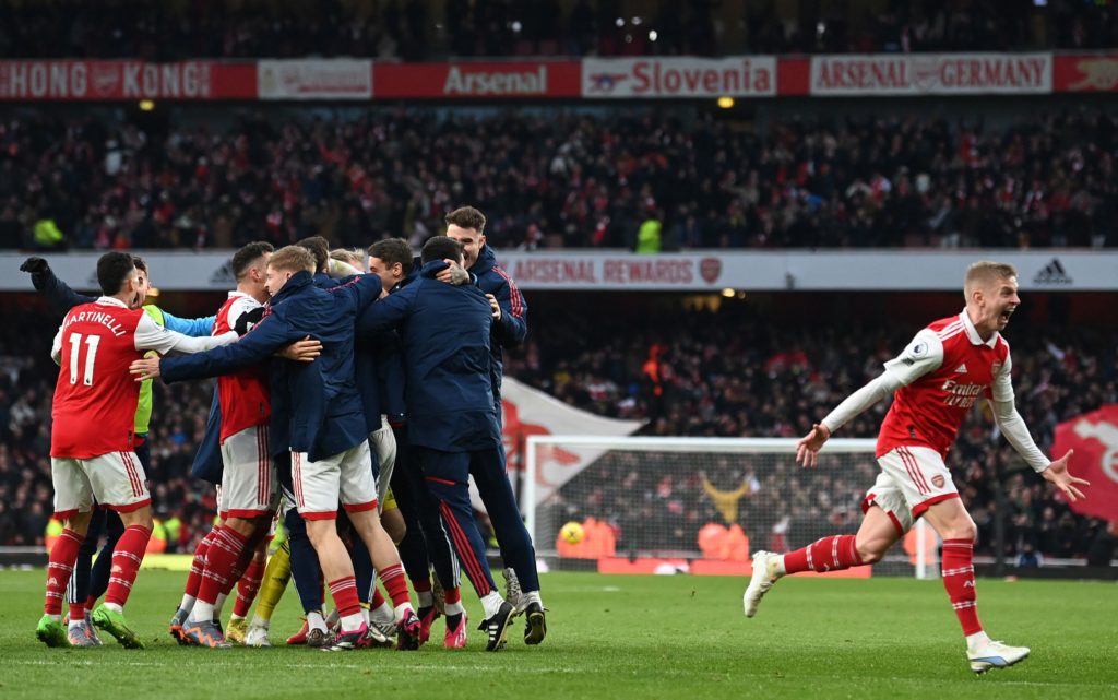 Arsenal's English midfielder Reiss Nelson (unseen) celebrates after scoring his team third goal of the team during the English Premier League football match between Arsenal and Bournemouth at the Emirates Stadium in London on March 4, 2023. (Photo by GLYN KIRK/AFP via Getty Images)