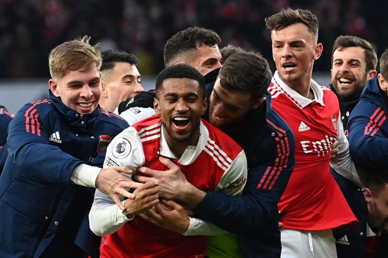 Arsenal's English midfielder Reiss Nelson (C) celebrates after scoring his team third goal of the team during the English Premier League football match between Arsenal and Bournemouth at the Emirates Stadium in London on March 4, 2023. (Photo by GLYN KIRK/AFP via Getty Images)