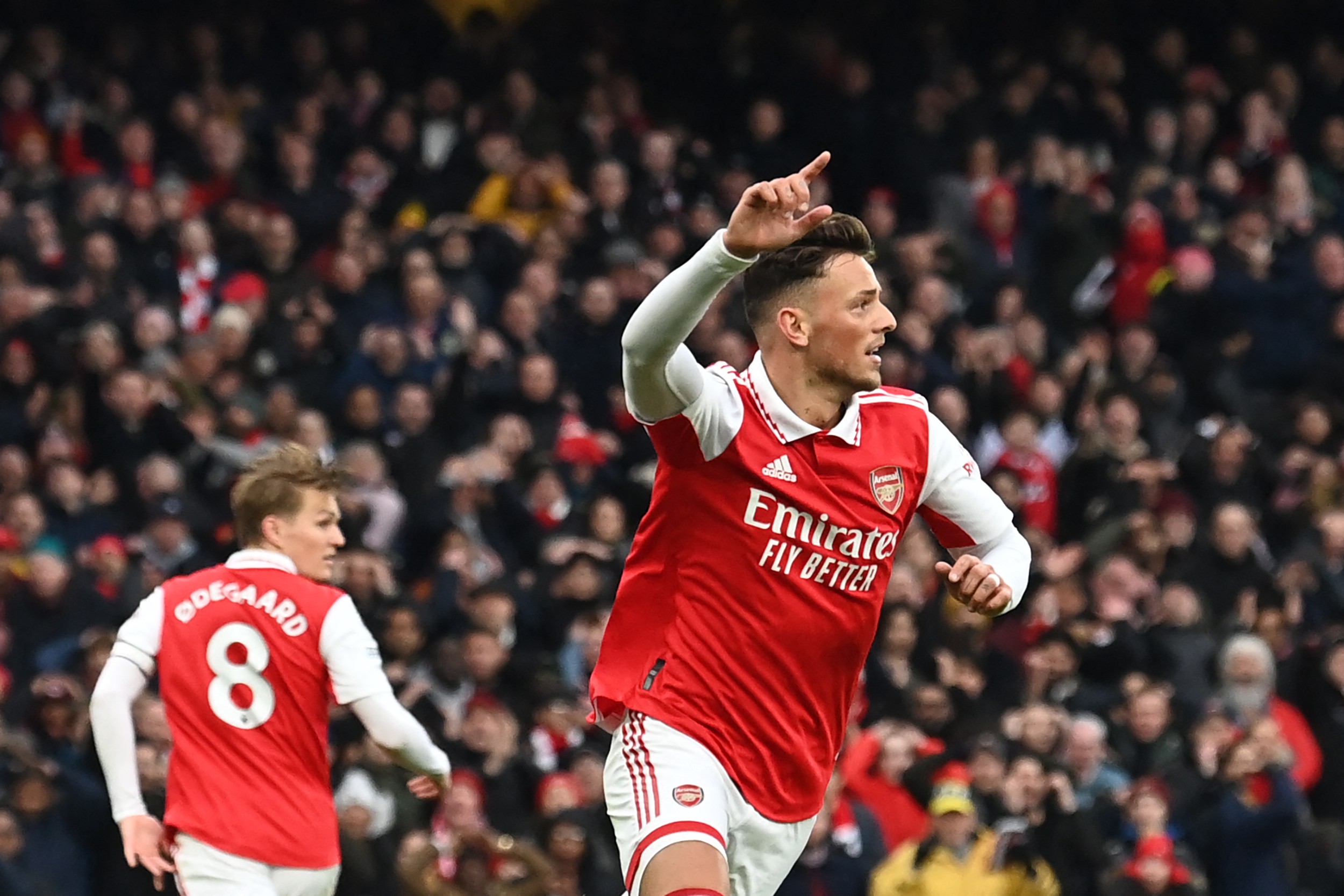 Arsenal's English defender Ben White (R) celebrates after scoring his team second goal during the English Premier League football match between Arsenal and Bournemouth at the Emirates Stadium in London on March 4, 2023. (Photo by GLYN KIRK/AFP via Getty Images)