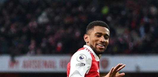 Arsenal's English midfielder Reiss Nelson celebrates after scoring his team third goal of the team during the English Premier League football match between Arsenal and Bournemouth at the Emirates Stadium in London on March 4, 2023. (Photo by GLYN KIRK/AFP via Getty Images)
