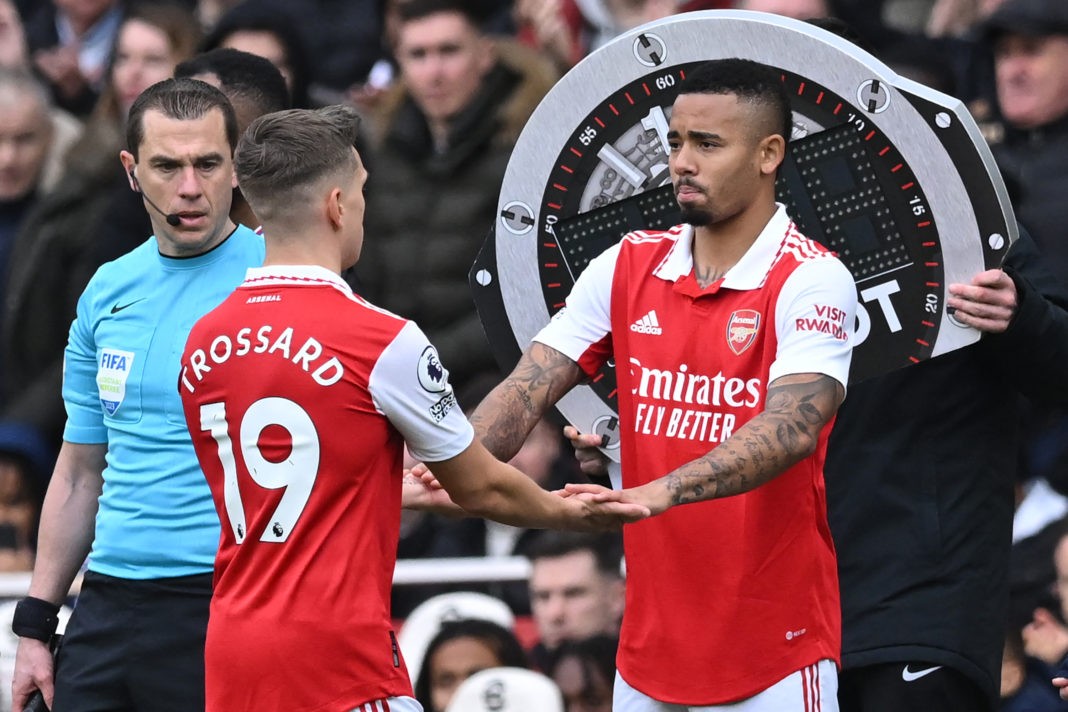 Arsenal's Brazilian striker Gabriel Jesus (R) comes on for Arsenal's Belgian midfielder Leandro Trossard (L) during the English Premier League football match between Arsenal and Crystal Palace at the Emirates Stadium in London on March 19, 2023. (Photo by JUSTIN TALLIS/AFP via Getty Images)