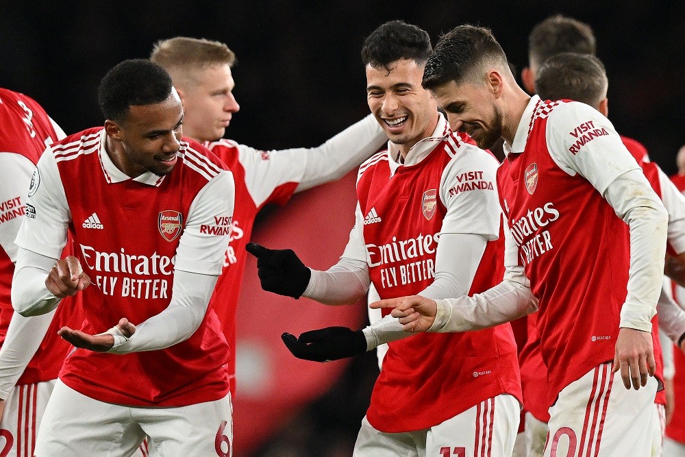 Arsenal's Gabriel Martinelli celebrates scoring the team's second goal with Gabriel Magalhaes (L) and Jorginho during the English Premier League football match between Arsenal and Everton at the Emirates Stadium in London on March 1, 2023. (Photo by GLYN KIRK/AFP via Getty Images)