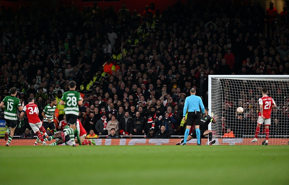 Arsenal's Swiss midfielder Granit Xhaka (2L) scores the opening goal during the UEFA Europa League round of 16, second-leg football match between Arsenal and Sporting Lisbon at the Emirates Stadium in London on March 16, 2023. (Photo by GLYN KIRK/AFP via Getty Images)