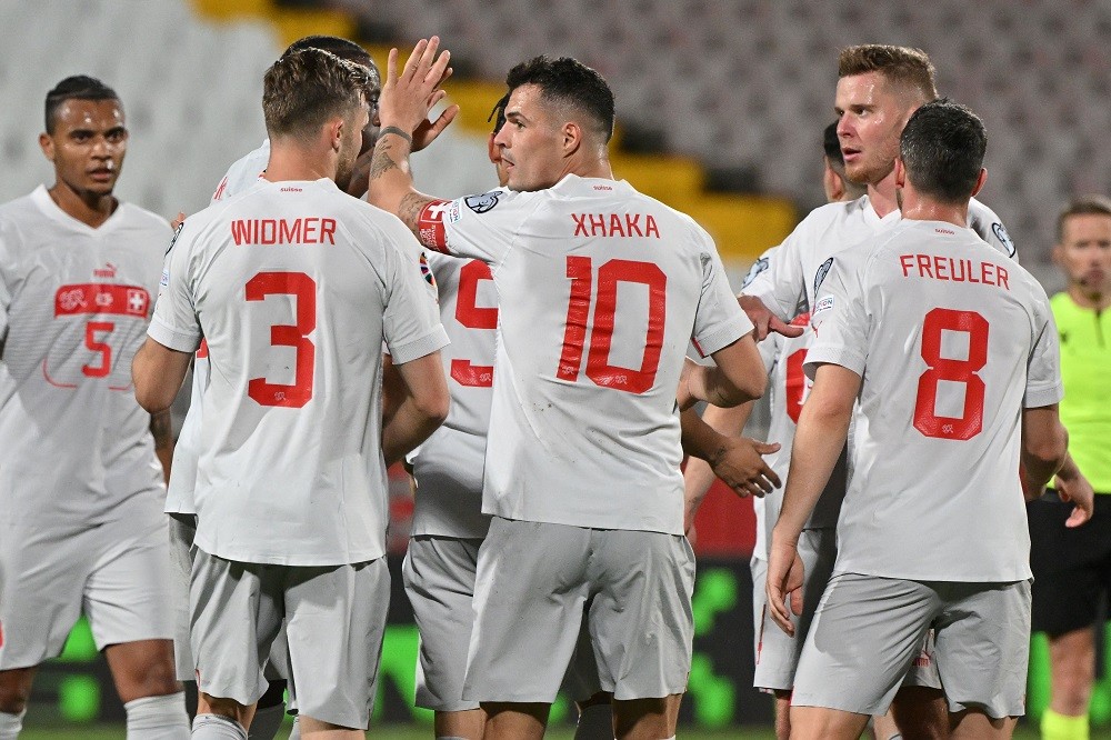 Switzerland's Granit Xhaka (C) celebrates after scoring a goal with his team mates during the UEFA Euro 2024 Group I qualification match between Belarus and Switzerland, at the Karadjordje stadium, in Novi Sad on March 25, 2023. (Photo by ANDREJ ISAKOVIC/AFP via Getty Images)