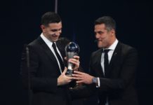 Argentina and Aston Villa goalkeeper Emiliano Martinez (L) receives from Brazilian former football player Julio Cesar the Best FIFA Mens Goalkeeper award during the Best FIFA Football Awards 2022 ceremony in Paris on February 27, 2023. (Photo by FRANCK FIFE/AFP via Getty Images)