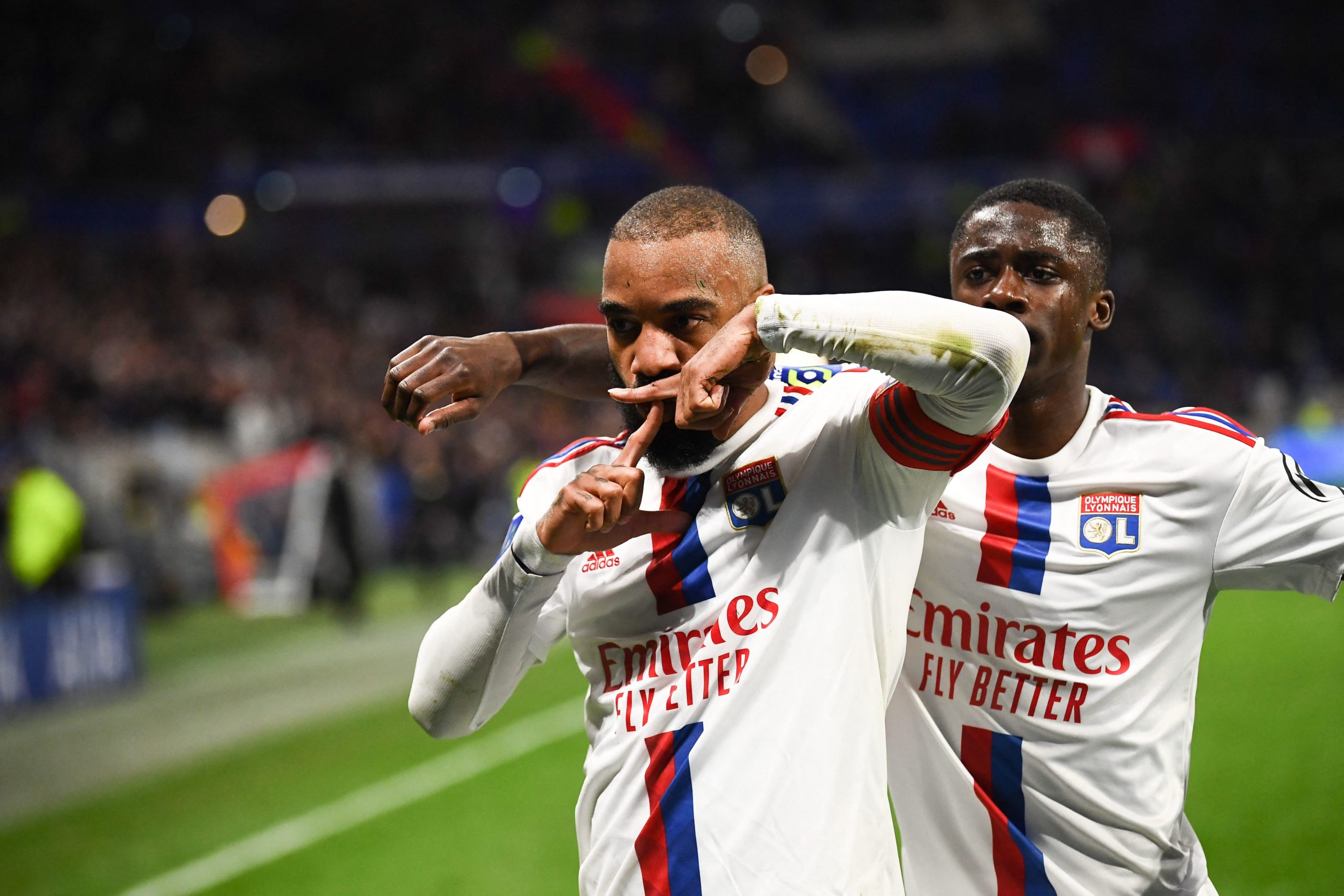 Olympique Lyonnais' Alexandre Lacazette (L) celebrates scoring against FC Nantes in a French L1 football match at The Groupama Stadium in Decines-Charpieu, central-eastern France on March 17, 2023. (Credit: OLIVIER CHASSIGNOLE/AFP via Getty Images)