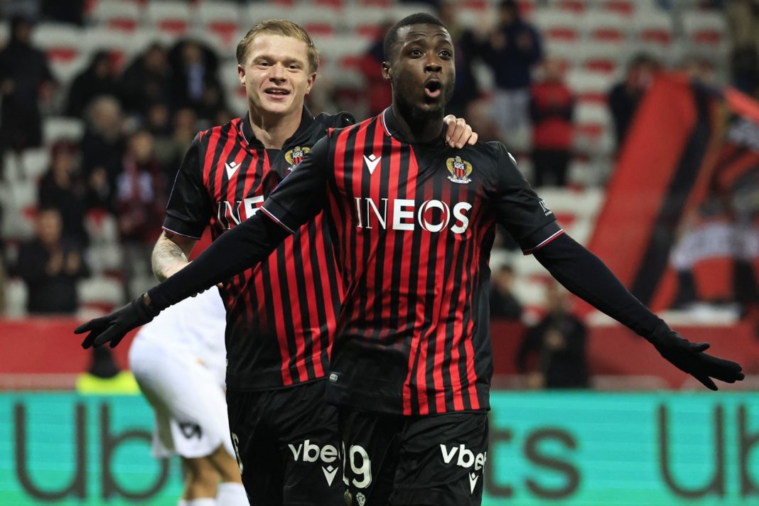 Nice's Ivorian forward Nicolas Pepe (R) celebrates with Nice's French defender Melvin Bard after scoring his team's third goal during the French L1 football match between OGC Nice and Montpellier Herault SC at the Allianz Riviera Stadium in Nice, south-eastern France, on January 11, 2023. - (Photo by VALERY HACHE/AFP via Getty Images)