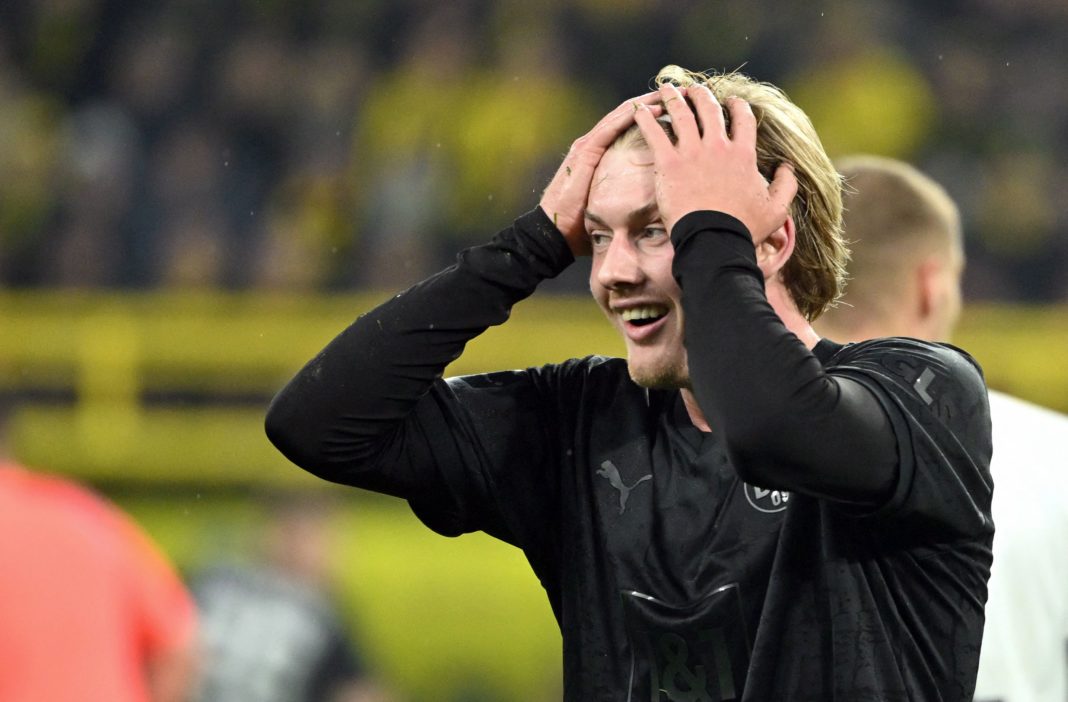 Dortmund's German midfielder Julian Brandt reacts during the German first division Bundesliga football match between Borussia Dortmund and Hertha Berlin in Dortmund on February 19, 2023. - DFL REGULATIONS PROHIBIT ANY USE OF PHOTOGRAPHS AS IMAGE SEQUENCES AND/OR QUASI-VIDEO (Photo by Ina FASSBENDER / AFP) / DFL REGULATIONS PROHIBIT ANY USE OF PHOTOGRAPHS AS IMAGE SEQUENCES AND/OR QUASI-VIDEO (Photo by INA FASSBENDER/AFP via Getty Images)